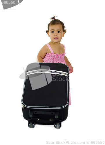 Image of cute little girl with suitcase