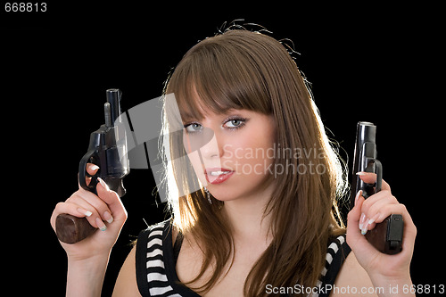 Image of Attractive young woman with two pistol. Isolated