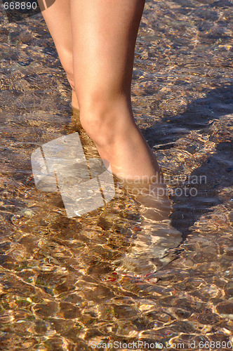 Image of woman legs in sea water
