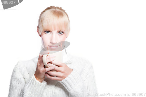 Image of Beautiful woman holding coffee cup