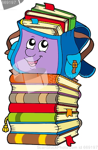 Image of Cute school bag on pile of books