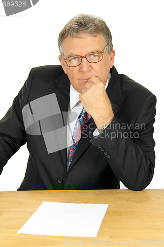 Image of Pondering Middle Aged Businessman