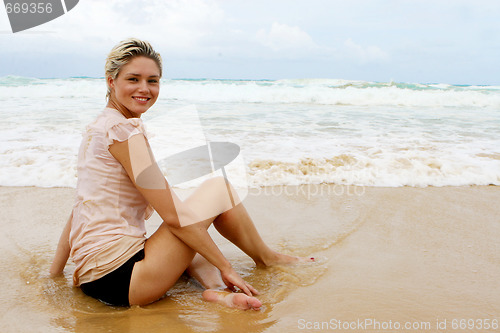 Image of Blond woman at the beach.