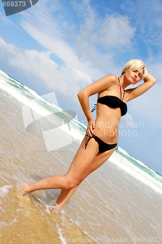 Image of Blond woman at the beach.