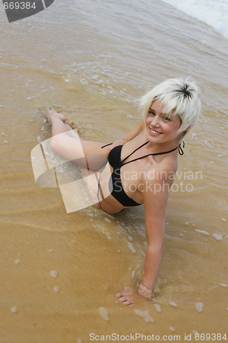 Image of Blond woman at the beach.