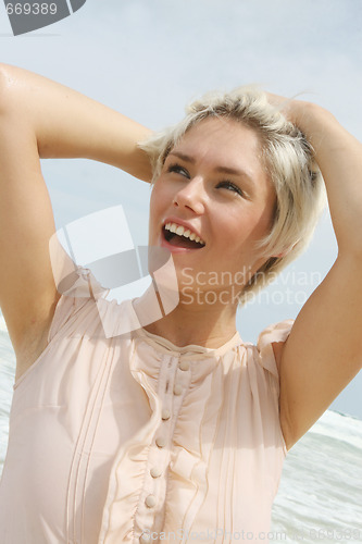 Image of blond woman at the beach.