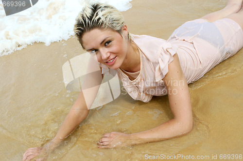 Image of Blond woman at the beach.