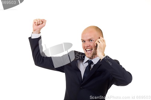 Image of winning businessman on the phone