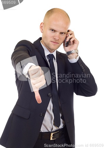 Image of Businessman with bad news on his cell phone