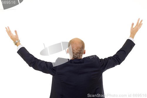 Image of businessman with his arms up