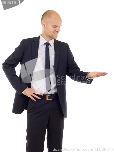 Image of young cheerful business man presenting