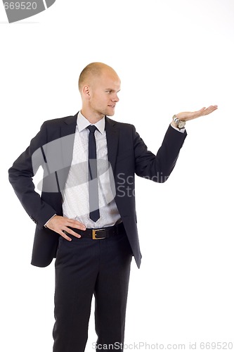 Image of young cheerful business man giving a presentation