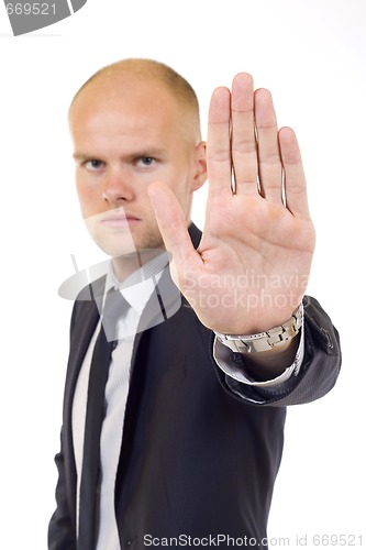 Image of business man making stop. Focus on the hand