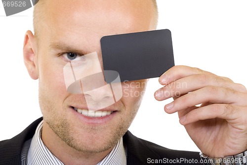 Image of Young businessman with blank card