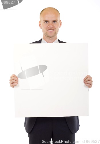 Image of Businessman holding blank board