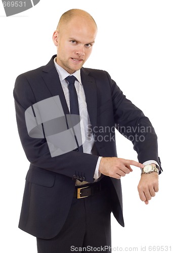 Image of Businessman looking at  his watch