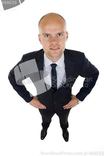 Image of Businessman in suit stands with confidence