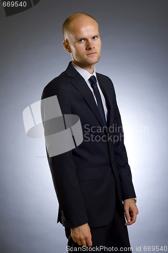 Image of young businessman standing