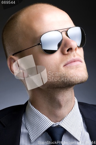 Image of closeup picture of a businessman with sunglasses