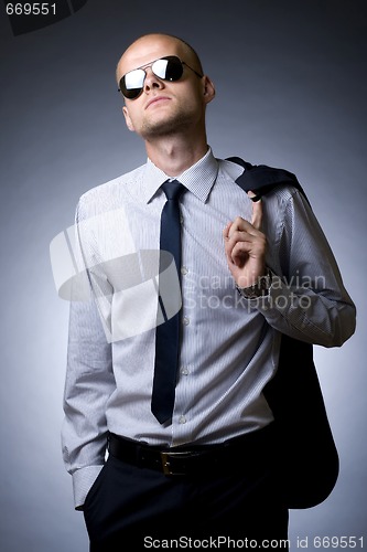 Image of young businessman looking down to you