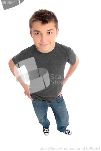 Image of Boy hands on hips looking up at you