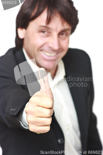 Image of Happy businessman showing thumb up