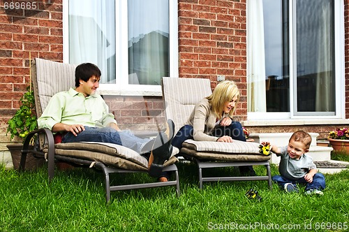 Image of Happy family relaxing at home