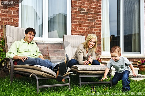 Image of Happy family relaxing at home