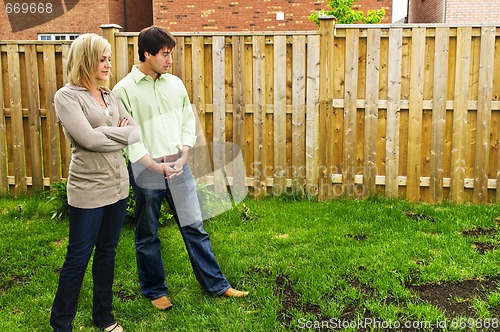 Image of Couple concerned about lawn