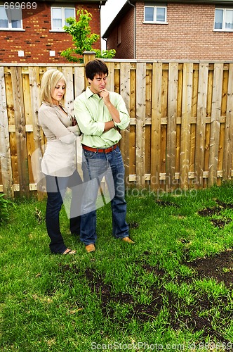 Image of Couple concerned about lawn