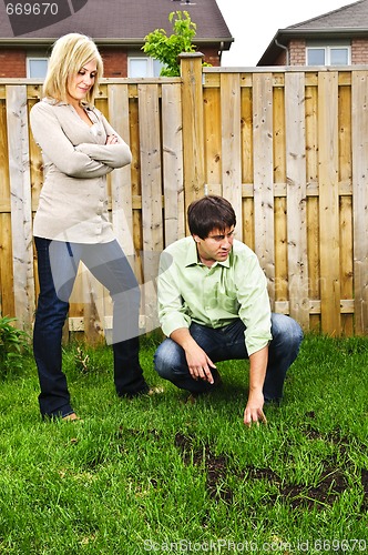 Image of Couple concerned about lawn