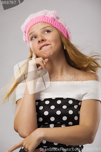 Image of beautiful thoughtful girl in pink beret