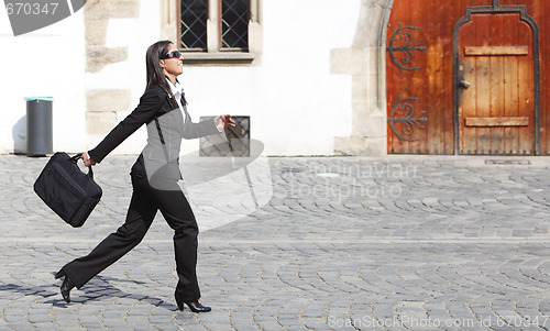 Image of Businesswoman in a hurry