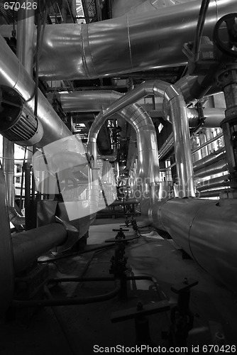 Image of Equipment, cables and piping as found inside of a modern industr