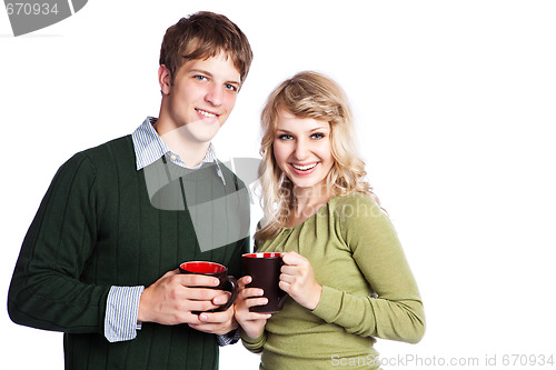 Image of Caucasian couple holding coffee cups