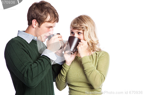 Image of Caucasian couple holding coffee cups