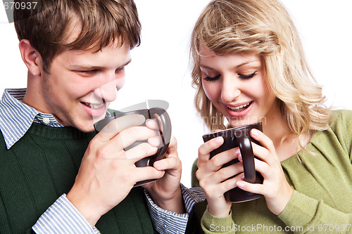 Image of Caucasian couple holding coffee cups