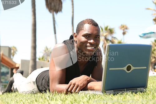 Image of African Amercian Man Working on a Laptop