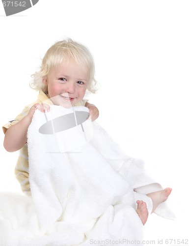 Image of Playful Kid Holding a Bath Towel Smiling
