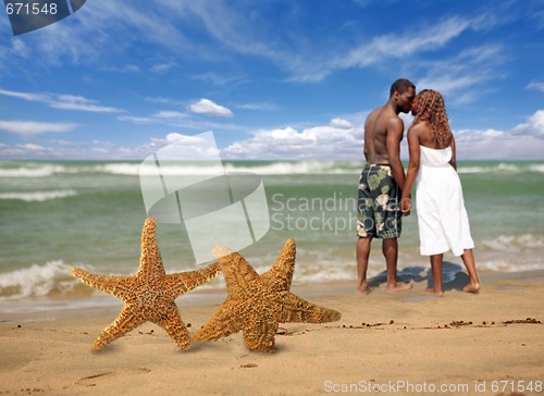 Image of Romantic Couple Walking Into the Surf