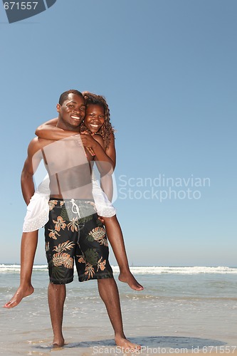 Image of Playful Couple on the Beach in the Ocean Water