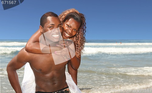 Image of African American Couple Smiling on the Beach Outdoors