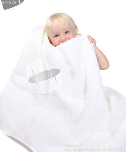 Image of Adorable Happy Baby Boy Holding Towel to His Face Smiling