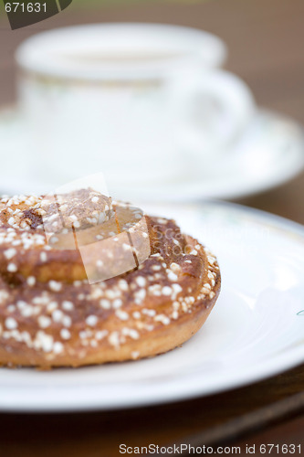 Image of Pastry bun and coffee.