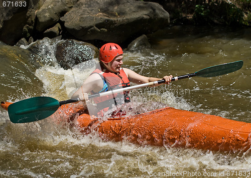 Image of teenage girl white water kayaking