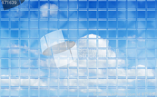 Image of perfect sky through glass tile wall