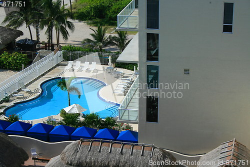 Image of Swimming Pool and Lounge Chairs