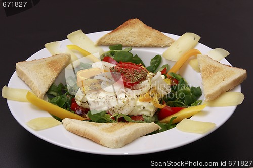 Image of 6	baked feta cheese on labs lettuce
