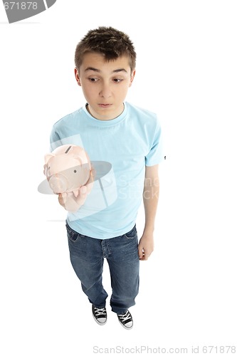 Image of Boy holding a piggy bank money box