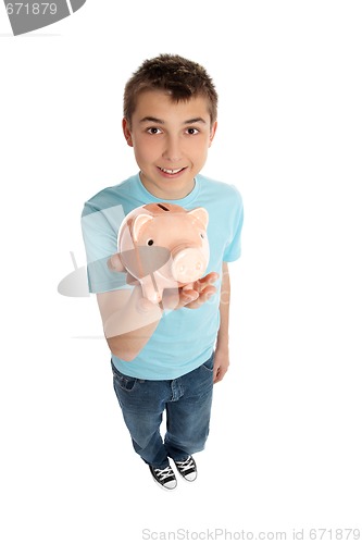 Image of Smiling boy holding a pink pig money box
